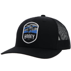 profile view of black on black Cheyenne hat with blue, grey, black Cheyenne artwork patch