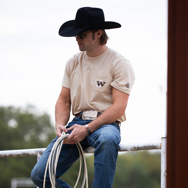 front of the John Wayne Tan tee on male model lifestyle photo