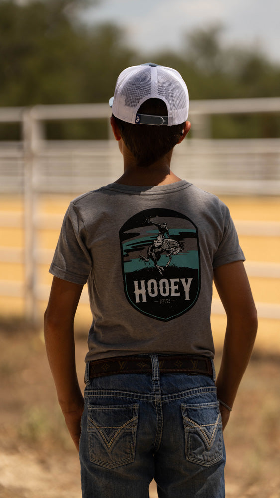 male model posing in Hooey Cheyenne tee in outdoor setting