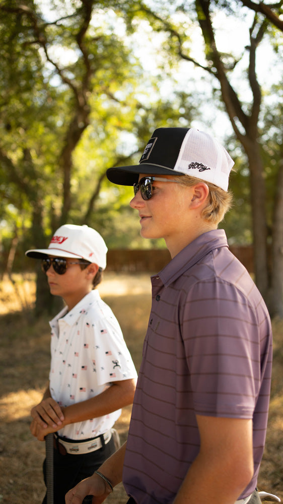 young models posing in hooey golf gear