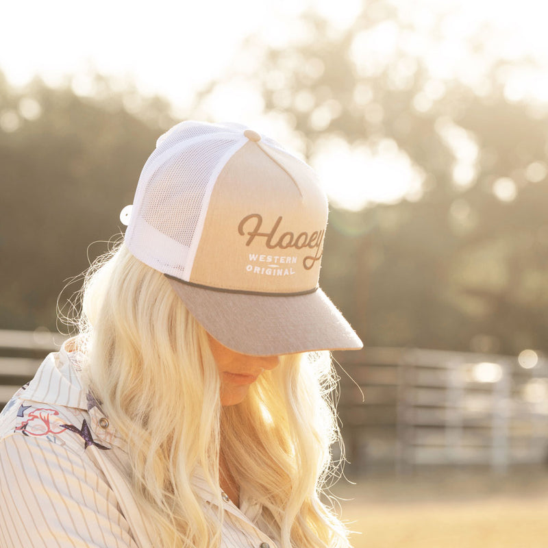 female model posing in tan hooey hat