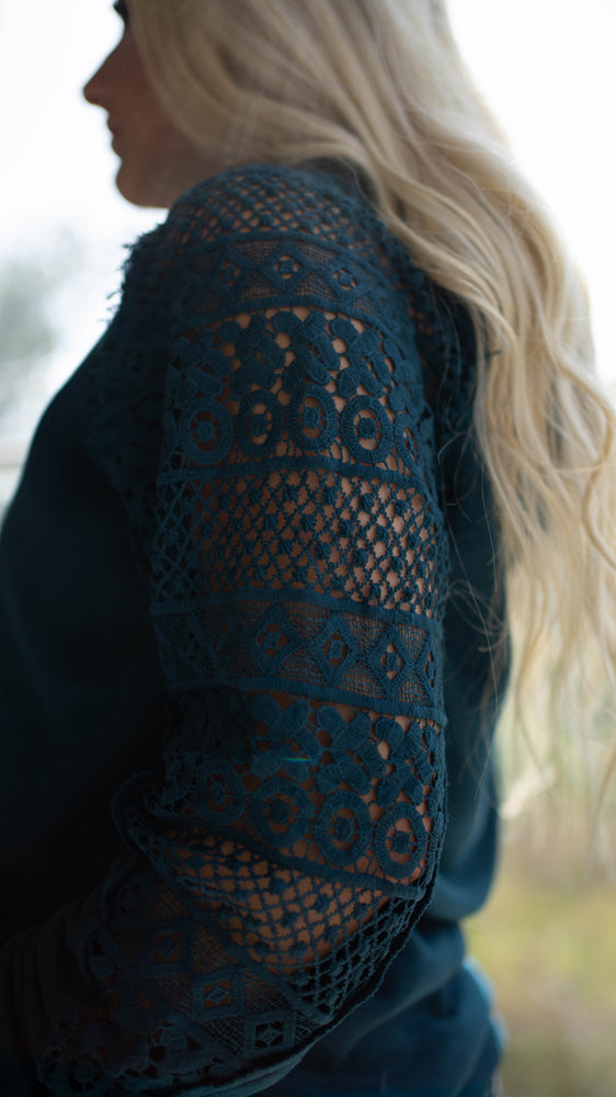 close up of navy blue Hooey hoody worn by female model