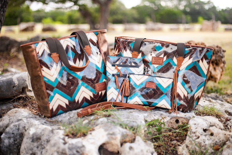 white, brown, teal chevon pattern hand bag collection